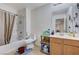 Full bathroom featuring a bathtub, toilet, and vanity with storage at 8783 Halcon Ave, Las Vegas, NV 89148