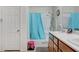 Bright bathroom features a shower-tub combination and vanity with double sinks at 8783 Halcon Ave, Las Vegas, NV 89148