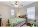 Cozy bedroom with soft carpet and a ceiling fan for comfortable living at 8783 Halcon Ave, Las Vegas, NV 89148