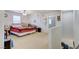 Spacious bedroom with a ceiling fan, bright windows and carpet flooring at 8783 Halcon Ave, Las Vegas, NV 89148