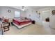 Large bedroom with carpet flooring, ceiling fan and bright windows at 8783 Halcon Ave, Las Vegas, NV 89148