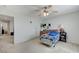 Bedroom featuring carpet floors, ceiling fan, and bright, natural light at 8783 Halcon Ave, Las Vegas, NV 89148
