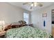 Light bedroom featuring sliding closet and window with a ceiling fan at 8783 Halcon Ave, Las Vegas, NV 89148