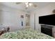 Comfortable bedroom featuring large closet, bright window, and updated fan at 8783 Halcon Ave, Las Vegas, NV 89148