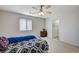 Large bedroom with light-filled window and neutral carpet at 8783 Halcon Ave, Las Vegas, NV 89148