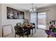 Open dining area with a chandelier and sliding glass doors to the patio at 8783 Halcon Ave, Las Vegas, NV 89148