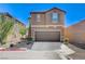 Charming two-story home featuring a well-manicured front yard and a spacious two-car garage at 8783 Halcon Ave, Las Vegas, NV 89148