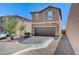 Beautiful two-story home featuring a well-maintained front yard, a two-car garage, and a private driveway at 8783 Halcon Ave, Las Vegas, NV 89148