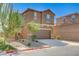 Attractive home featuring a 2-car garage, complemented by drought-resistant landscaping and a private driveway at 8783 Halcon Ave, Las Vegas, NV 89148