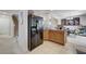 Open kitchen with granite countertops and a view of the dining room at 8783 Halcon Ave, Las Vegas, NV 89148