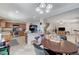 Open-concept kitchen and dining area with a view into the living room at 8783 Halcon Ave, Las Vegas, NV 89148