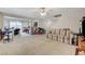 Open-concept living room leading to dining area offers lots of natural light at 8783 Halcon Ave, Las Vegas, NV 89148