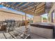 Backyard featuring hot tub and grill area with shaded patio cover at 916 Bob Barney Ave, North Las Vegas, NV 89086