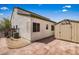 Home exterior with side patio, air conditioning unit, and backyard shed at 916 Bob Barney Ave, North Las Vegas, NV 89086
