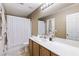 Bathroom vanity with lighting, mirror, sink, and shower/tub combo at 916 Bob Barney Ave, North Las Vegas, NV 89086