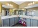 Well-lit bathroom features double sinks, ample counter space, and modern fixtures for a luxurious feel at 916 Bob Barney Ave, North Las Vegas, NV 89086