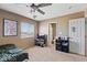 Bedroom featuring a ceiling fan, window, carpet flooring, and ensuite bathroom at 916 Bob Barney Ave, North Las Vegas, NV 89086