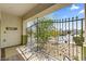 The charming gated entry way features a tile floor and iron gate at 916 Bob Barney Ave, North Las Vegas, NV 89086