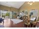 Open living space with hardwood floors, high ceiling and adjacent dining area at 916 Bob Barney Ave, North Las Vegas, NV 89086