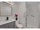 Bathroom features modern vanity, sink, and walk-in shower with glass door at 9526 Summer Furnace St, Las Vegas, NV 89178