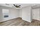 Spacious bedroom featuring stylish flooring, an overhead fan, and access to a utility closet at 9526 Summer Furnace St, Las Vegas, NV 89178