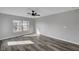 This bedroom boasts a spacious layout, modern flooring, an overhead fan, and natural light at 9526 Summer Furnace St, Las Vegas, NV 89178