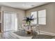 Dining area with decorative centerpiece, sliding doors, and modern table set at 9526 Summer Furnace St, Las Vegas, NV 89178