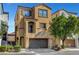 Beautiful two-story home featuring a balcony, attached two car garage and manicured landscaping at 9526 Summer Furnace St, Las Vegas, NV 89178