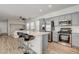 Modern kitchen with stainless steel appliances, sleek gray cabinetry, and a spacious center island at 9526 Summer Furnace St, Las Vegas, NV 89178