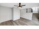 Bright living room featuring modern flooring, a staircase, and an open-concept layout at 9526 Summer Furnace St, Las Vegas, NV 89178