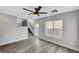 Bright living room featuring modern flooring, a staircase, and a glass panel back door at 9526 Summer Furnace St, Las Vegas, NV 89178