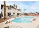 Spacious backyard featuring a diving board, large swimming pool, palm trees, and a lounging area for relaxation and fun at 408 N Torrey Pines Dr, Las Vegas, NV 89107