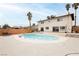 Backyard oasis with a large swimming pool, a patio, palm trees, and privacy walls, perfect for outdoor relaxation and entertainment at 408 N Torrey Pines Dr, Las Vegas, NV 89107