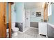 Stylishly updated bathroom with a tiled shower, modern vanity, decorative wall paneling, and soft, light blue wall paint at 408 N Torrey Pines Dr, Las Vegas, NV 89107