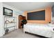 Bedroom featuring desk area, bed and shelving unit at 408 N Torrey Pines Dr, Las Vegas, NV 89107