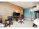 Bedroom featuring bunk bed, desk and brick accent wall at 408 N Torrey Pines Dr, Las Vegas, NV 89107