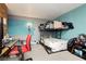 Bedroom with bunk bed, desk, and teal accent wall at 408 N Torrey Pines Dr, Las Vegas, NV 89107
