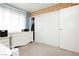Well-lit bedroom with brick accent, white furniture, and closet at 408 N Torrey Pines Dr, Las Vegas, NV 89107