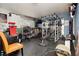 Home gym features multiple weight machines, a treadmill, and rubber flooring at 408 N Torrey Pines Dr, Las Vegas, NV 89107