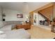 Inviting living room with a comfortable sectional sofa and staircase access at 408 N Torrey Pines Dr, Las Vegas, NV 89107