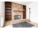 Living room featuring a brick fireplace, built-in shelves, and hardwood floors at 408 N Torrey Pines Dr, Las Vegas, NV 89107