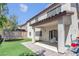 Spacious backyard features a covered patio, artificial grass and a trampoline, perfect for outdoor activities and relaxation at 10135 Haymarket Peak Ave, Las Vegas, NV 89166