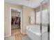 Modern bathroom with a tub, walk-in shower, and linen closet at 10135 Haymarket Peak Ave, Las Vegas, NV 89166