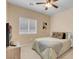 This bedroom is set up with a television and soft, comfortable bedding at 10135 Haymarket Peak Ave, Las Vegas, NV 89166