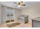 Cozy bedroom with a crib, window with natural light, ceiling fan, and area rug on carpeted floor at 10135 Haymarket Peak Ave, Las Vegas, NV 89166