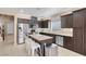 Spacious kitchen with an island, stainless steel appliances, and sleek cabinetry at 10135 Haymarket Peak Ave, Las Vegas, NV 89166