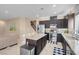 Open concept kitchen boasts a large island, stainless appliances, and seamless flow to living areas at 10135 Haymarket Peak Ave, Las Vegas, NV 89166