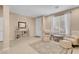 Inviting living area featuring neutral tones, tile flooring, and comfortable seating at 10135 Haymarket Peak Ave, Las Vegas, NV 89166