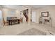 Open-concept living area with neutral tones, tile flooring, and elegant furnishings at 10135 Haymarket Peak Ave, Las Vegas, NV 89166