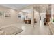 Open-concept living area with neutral tones, tile flooring, and elegant furnishings at 10135 Haymarket Peak Ave, Las Vegas, NV 89166